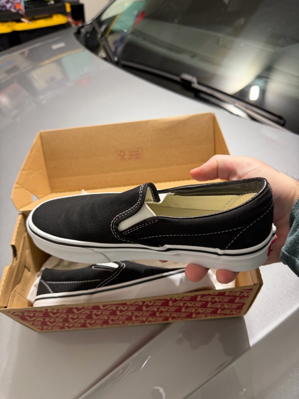 Vans Black and White Slip-On Sneakers